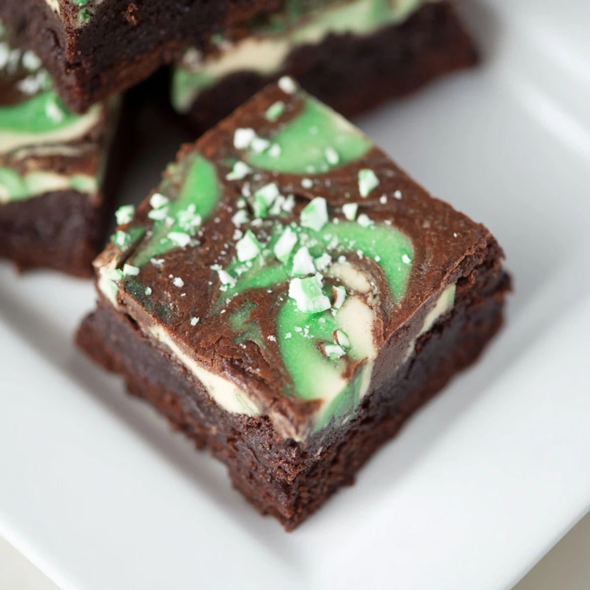 Delicious, swirled Peppermint Swirl Brownies: fudgy chocolate brownies with a creamy peppermint topping.