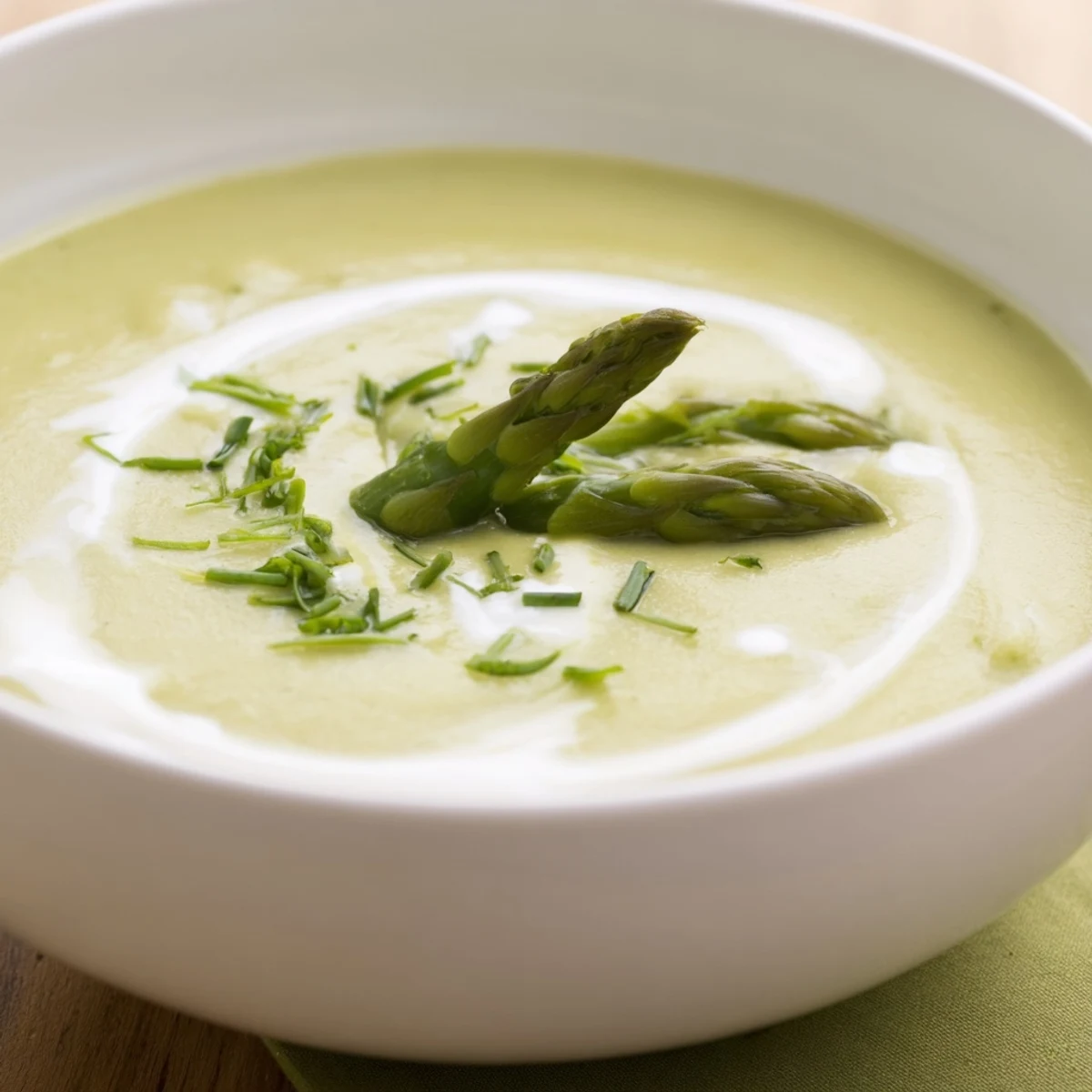 Aromatic creamy asparagus soup, a vibrant, springtime dish, ready to be served hot.