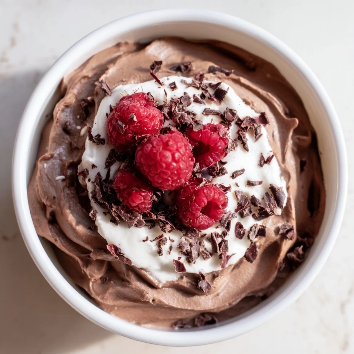 Decadent Chocolate Lunch Dessert layered with whipped cream and berries for an elegant midday treat.