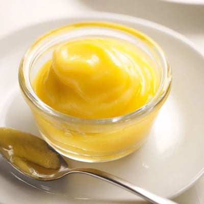 Vibrant yellow lemon curd recipe, ideal as a cake filling and delicious on scones this summer.